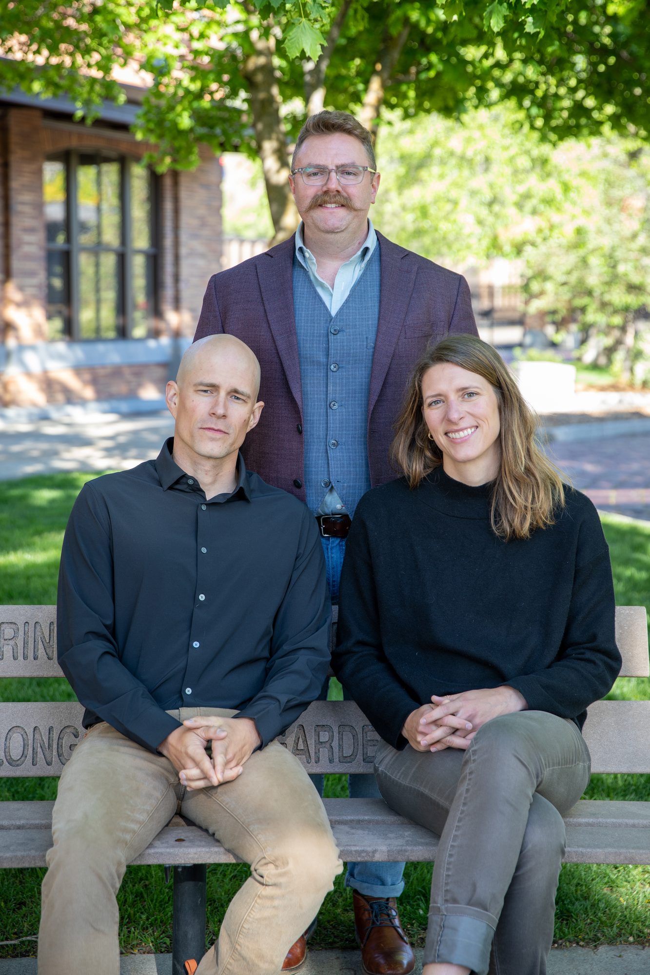 Sam Ore, Trebor Riddle and Cate Maher of Redtail Mental Health outside their Missoula office